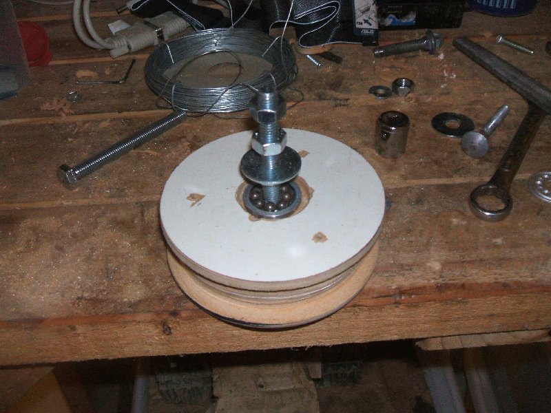 Exploded pulley with shaft and bearings